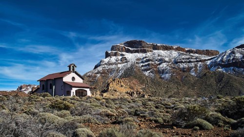 Ermita de las Nieves, A lonely church at the foot of snow-capped mountains under clear skies, Teide