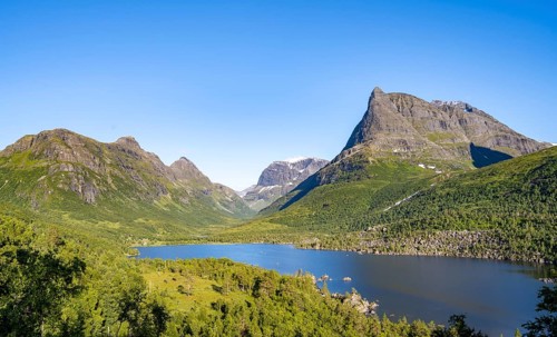 Picturesque mountain landscape in the Innerdalen high valley, Innerdalstårnet peaks and Lake