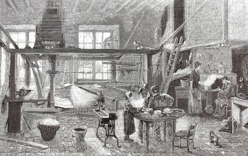 The interior of a silk weaver's workshop, 1877 in Lyon, France. At the center of the room is a