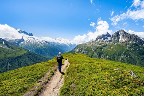 Mountaineers on hiking trail, mountain panorama with glaciated mountain peaks, Aiguille du Midi and