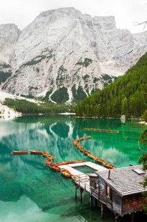 Summer vibrant landscape viewpoint s Lago di Braies Lake in italian Dolomites mountains in northern