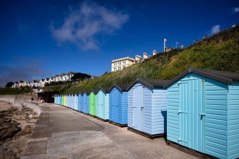 Colorful beach cabins, beach huts, light blue, Gyllyngvase Beach, often Gylly, sandy beach,