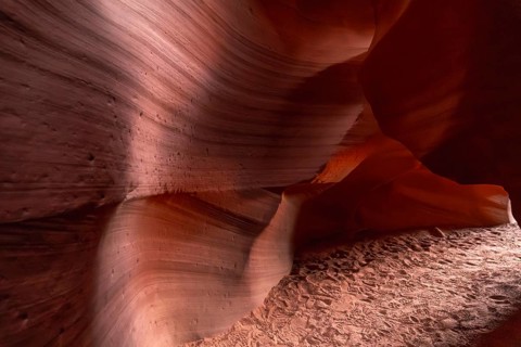 Antelope canyon slot canyon in page, arizona, showcasing swirling red orange sandstone walls,