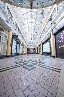 Empty passage with glass roof and decorative tile floor, elegant architecture, Dublin, Ireland
