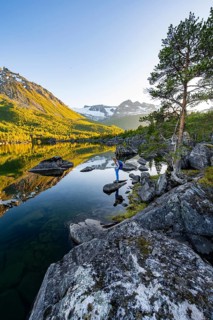 Young woman enjoying the picturesque mountain landscape in the Innerdalen high valley, mountain