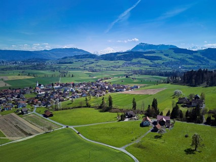 View of the village with the Alps with the Rigi in the background, Dietwil, Freiamt, Canton of