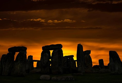 Stonehenge around 3000 BC, a megalithic structure from the Neolithic period, as a silhouette at