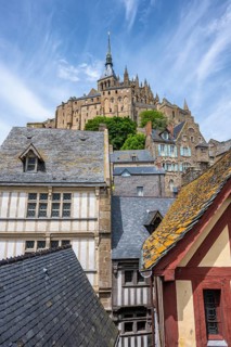 Medieval alley and traditional half-timbered houses within the fortress walls of Mont-Saint-Michel.