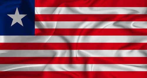 Realistic Liberia flag waving. Close up of flag of Liberia with cloth texture
