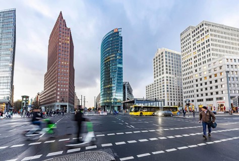 Potsdamer Platz Berlin in the evening with traffic on the streets. When it rains, the skyscrapers
