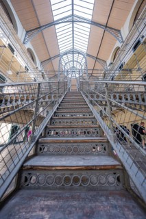 Steel staircase inside a prison under glass roof, Kilmainham Gaol Prison, Dublin, Ireland