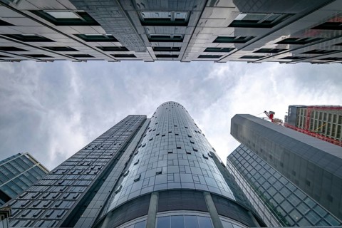 View up to the tops of skyscrapers with main tower in the middle, Frankfurt city, Germany