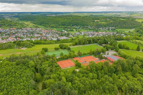 Panorama of tennis and soccer fields in a green, natural village landscape, Aidlingen sports field,