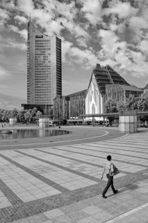 Morning atmosphere, Leipzig Augustusplatz with city skyscraper and university, reflection, water