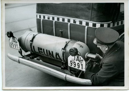 Taxi, Berlin, driving with gas, man checking gas bottle on an old vehicle, technical detail, around