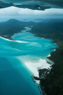 Aerial view of Whitsunday Island beach with aircraft wing, Airlie Beach, Queensland, Australia