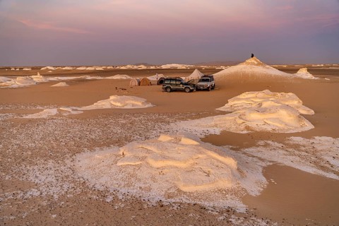 Sunset at a tented camp in the White Desert National Park in the Egyptian part of the Libyan