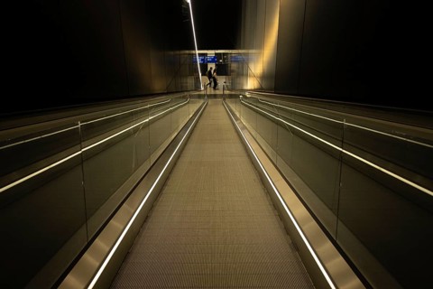 A long escalator connects two levels in Frankfurt Airport's new Terminal 3, Airport Terminal 3,