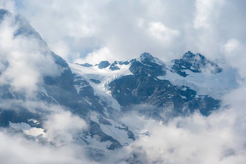 Clouds move around glaciated mountain peaks, view from Tanzbödeli, Bernese Alps, Bernese Oberland,