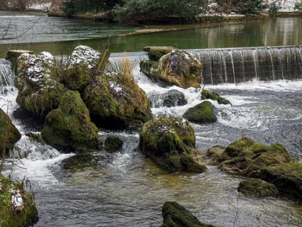 Small waterfall, winter in the English Garden, Munich, Bavaria, Germany