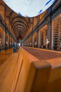 Interior view of a historic library with empty shelf and vaulted ceiling, Trinity Collage, Dublin,