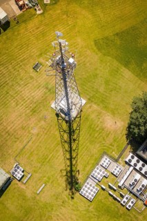 A radio tower casts a long shadow on the green field, Bunker Anlage, Calw, Germany