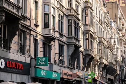 Shopping street with old houses from the Wilhelminian period in downtown Liège, Belgium