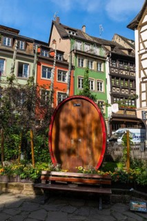 Large wooden wine barrel on the Place des Tripiers, half-timbered houses, Strasbourg, Alsace,