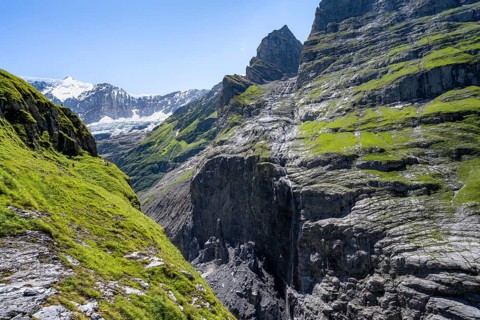 Rocky gorge with waterfall, mountain landscape with Grindelwald-Fiescherfirn glacier, Bernese Alps,