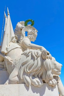 Goddess Minerva statue standing at the top of Rua Augusta Arch, Commerce square, Lisbon, Portugal