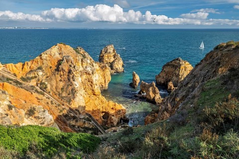 Scenic spectacular and Atlantic view of the Algarve coastline showing cliffs at Ponte da Piedade. A