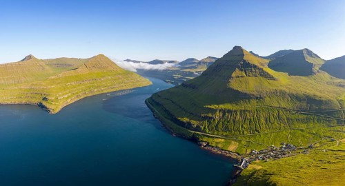 Panoramic view of Funningsfjørður near Funningur on Eysturoy island, fjord with steep mountains,