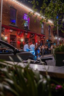 Out at night in front of a lively place with people enjoying the ambiance, Nightlife, Dublin,
