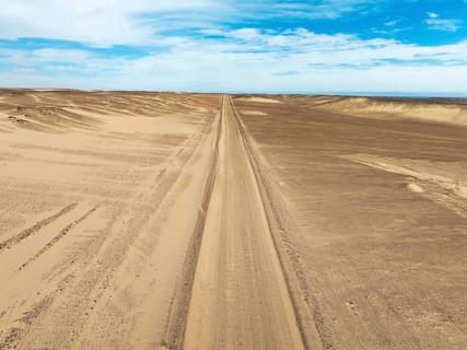 Desert road in the Namib Desert. Aerial view. Drone shot. Skeleton Coast, Namibia