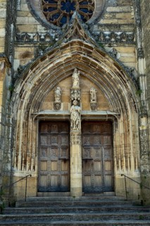 Saint Come d'Olt labelled Les Plus Beaux Villages de France, portal, Church of St Come and St