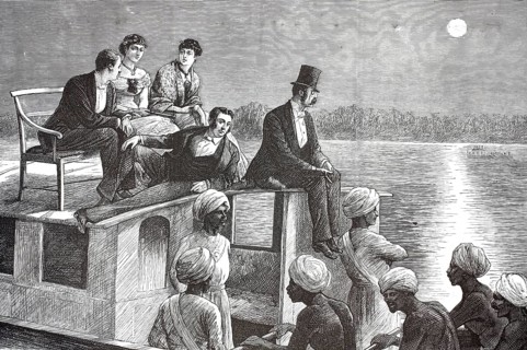 European colonial rulers and their Indian servants on a boat in Cochin, India. A group of European