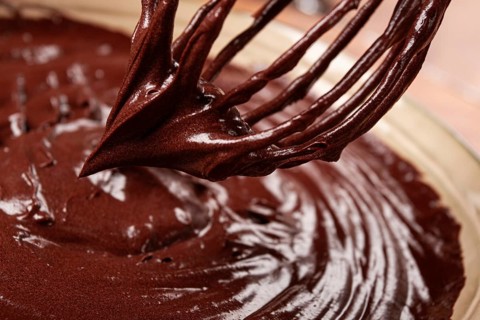 A bowl of chocolate dough, a whisk for whipping, baking, structure and consistency, homemade, top