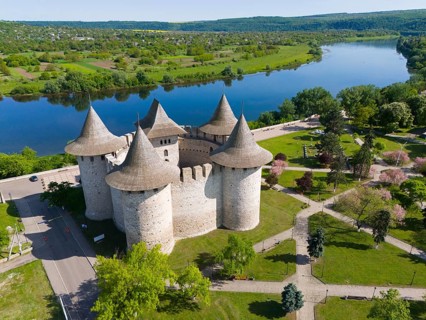 Medieval castle with towers on a river in picturesque landscape, aerial view, Soroca Fortress,