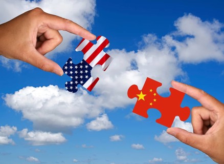 Two hands each hold a puzzle piece, silhouette, confrontation, rapprochement, war, trade war,