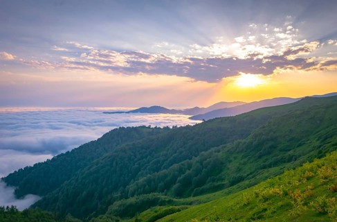 Stunning sunset above the horizon and clouds above Gomismta mount.Georgia
