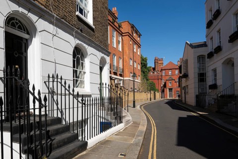 Narrow street lined with historic brick buildings, quiet residential area, Chelsea, London, Great