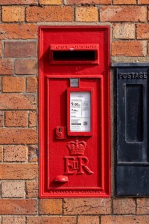 Traditional red letter box, house wall, Bretforton, The Cotswolds, England, United Kingdom