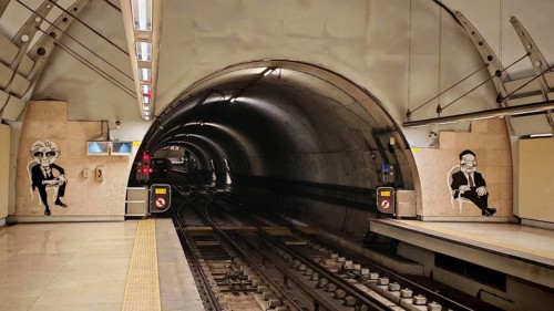Empty subway tunnel in Lisbon with graffiti on walls and clear tracks, Lisbon, Portugal