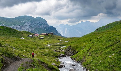 Hikers on a hiking trail at Bergbach Sousbach, Oberberg Almen, Bernese Alps, Bernese Oberland,