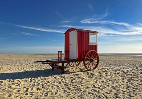 A red bathing cart on the west beach with the sea, North Sea island of Borzburg, East Frisia, Lower