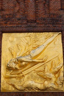 The gilded façade relief The Light Bringer by sculptor Bernhard Hötger, historic Böttcherstraße in