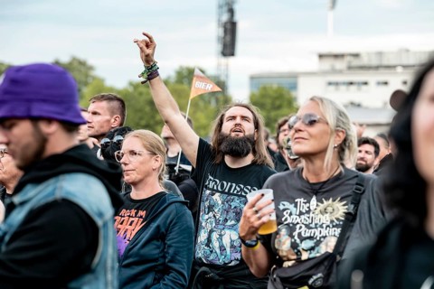 A festival-goer sings along at the performance of the US band Alter Bridge at Rock im Park on