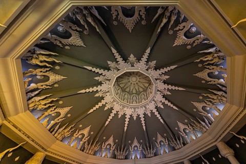 Decorated vaulted ceiling of the public prayer hall in the Buddhist temple complex Wat Phra That