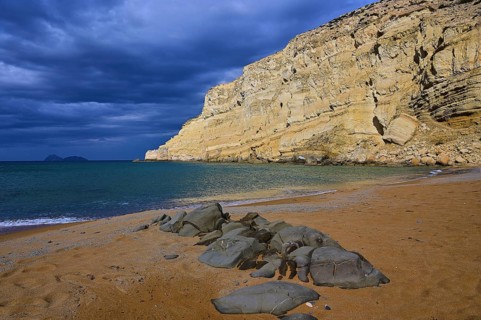 Red Beach, dream beach in the neighboring bay of Matala, a quiet beach with dramatic sky and