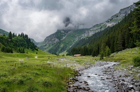 Bach Sousbach in a mountain valley, cloudy mountain landscape, Bernese Alps, Bernese Oberland,